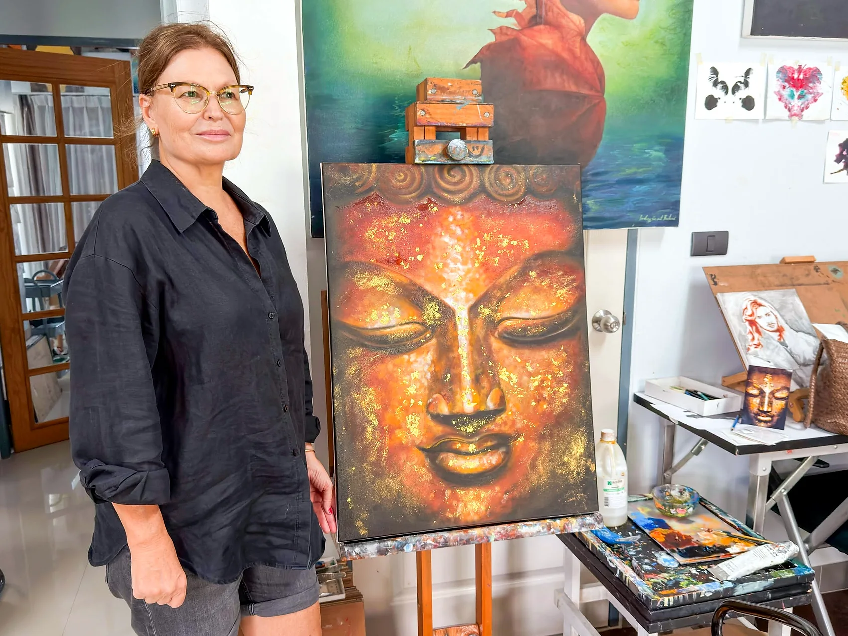 Adult learner with a warm-toned Buddha painting