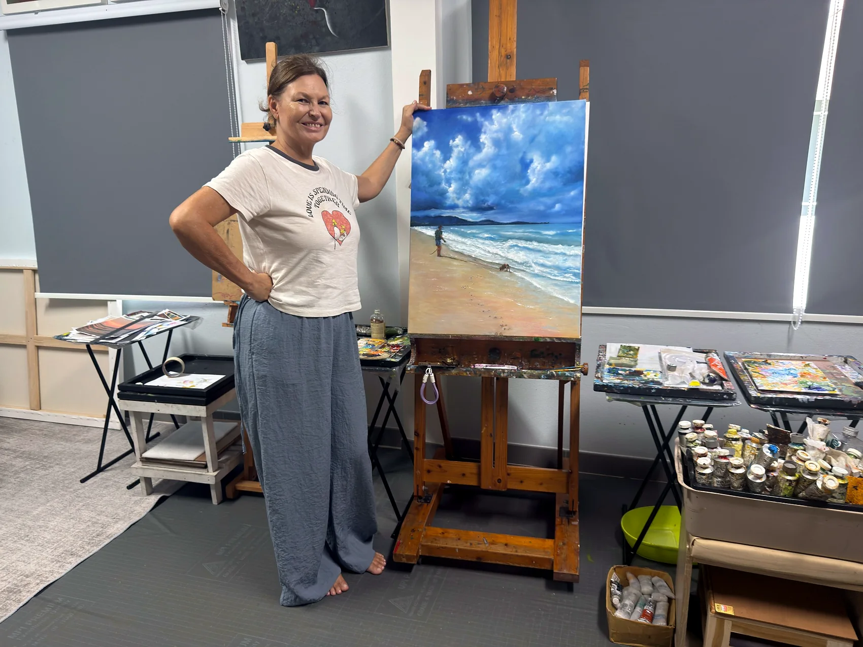 Adult learner presenting a completed seascape
