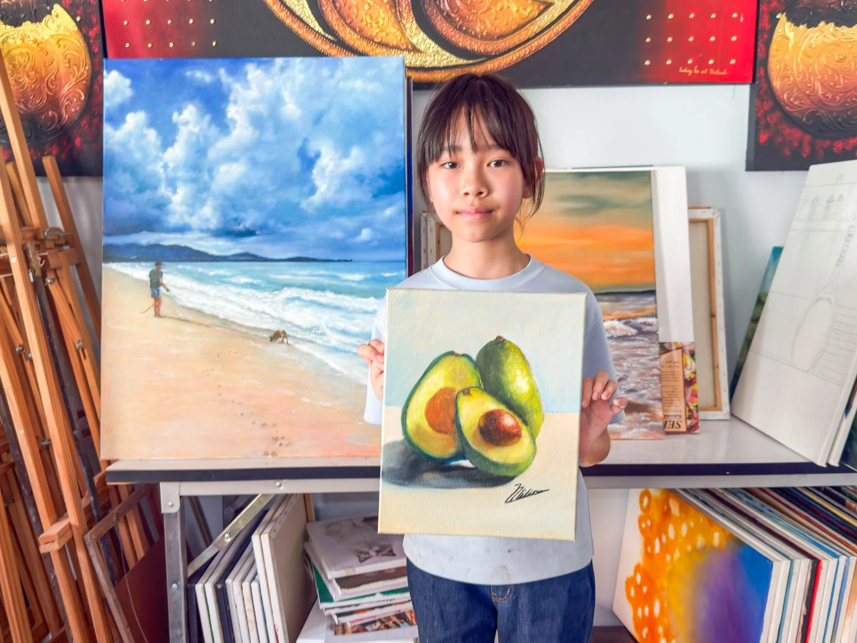 Young student presenting finished artwork