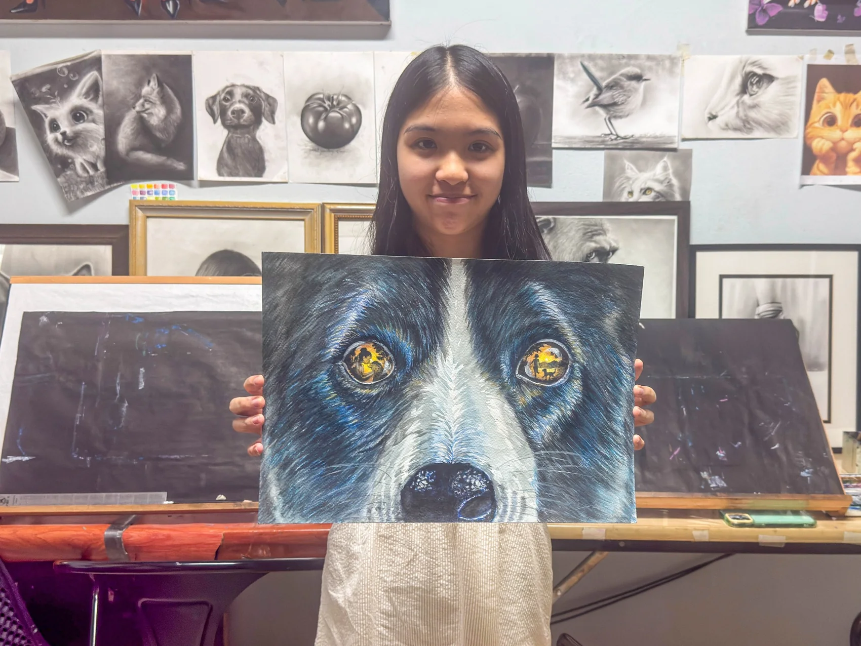 Young artist with completed work